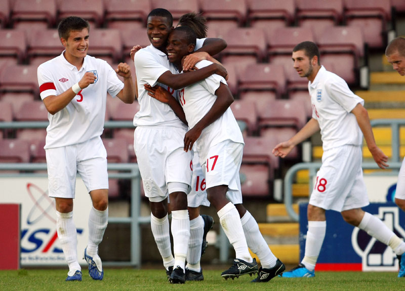 England U17 players congratulate Saido Berahino (centre) after the forward scored against Turkey in The FA International U17 Tournament in August 2009.
